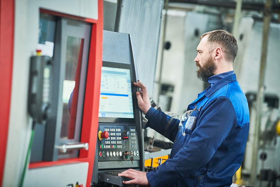 CNC Operator using CNC machine