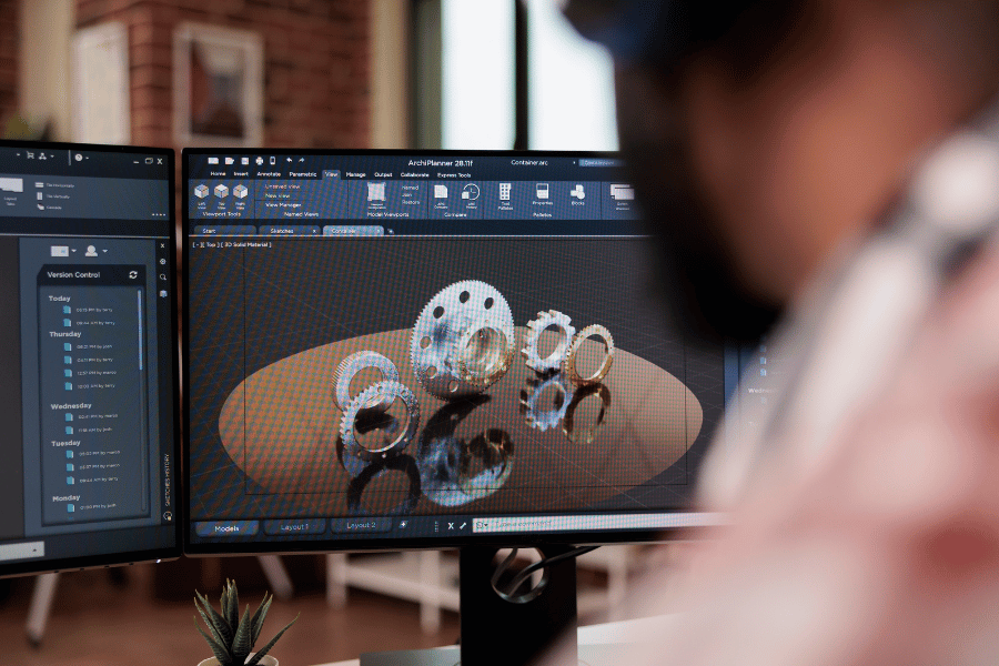 Engineer reviewing a CNC prototype design using CAD software
